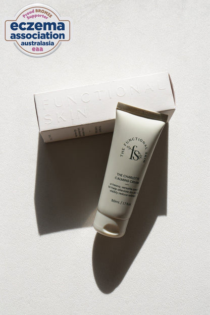 Tube of cream with packaging on a white background, featuring the Eczema Association Australasia logo.
