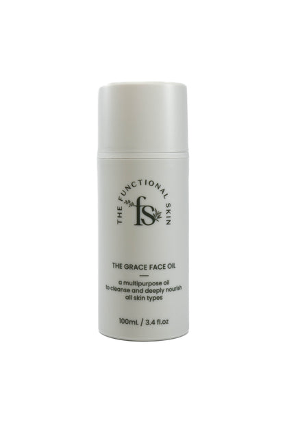 A white bottle with a pump dispenser labeled 'The Grace Face Oil' by The Functional Skin.