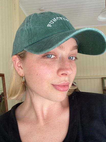 green functional skin hat on blonde 